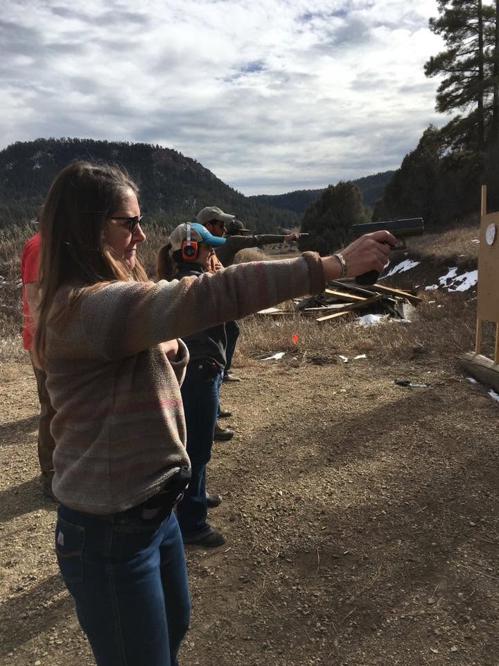 Student running her pistol on a cold Colorado morning